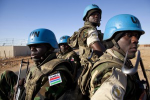 10 November 2011. El Fasher:  Gambian soldiers sitting at the back of a truck are escorting a visitor near UNAMID installations in El Fasher (North Darfur). 196 troops of the Gambian contingent are tasked with providing security at serveral UNAMID bases in El Fasher and escort to visitors.   Photo by Albert Gonzalez Farran - UNAMID